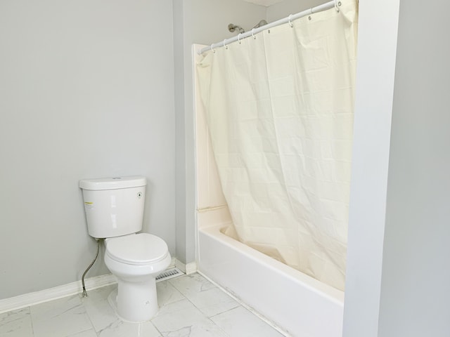 46 French St, Skowhegan, ME 04976 - full bath with marble look tile flooring, toilet, baseboards, and shower / bath combo with shower curtain
