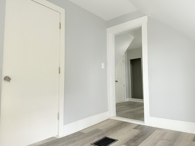 46 French St, Skowhegan, ME 04976 - hallway with wood finished floors, vaulted ceiling, and baseboards