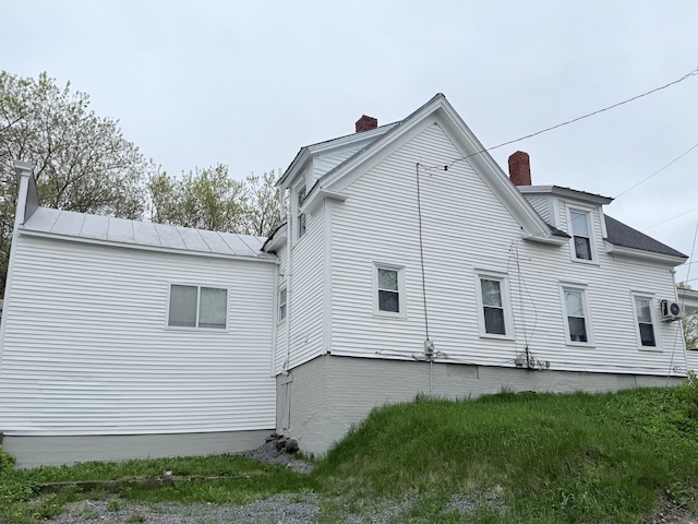 46 French St, Skowhegan, ME 04976 - rear view of property featuring a chimney