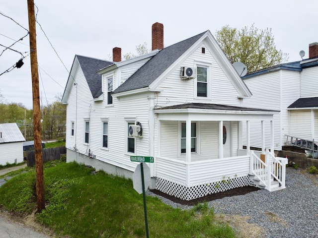 46 French St, Skowhegan, ME 04976 - view of front of home with a porch, a chimney, roof with shingles, and fence