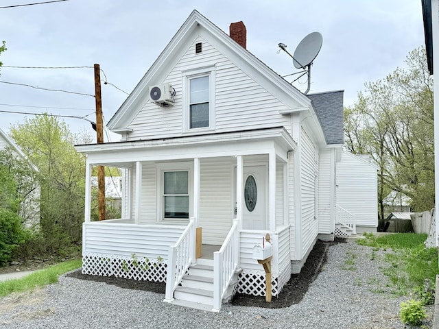 46 French St, Skowhegan, ME 04976 - view of front facade with a porch, roof with shingles, and a chimney