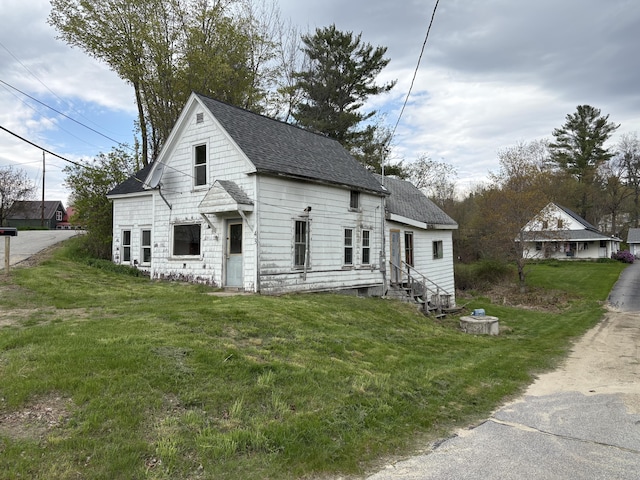 43 Berry Mills Rd, Carthage, ME 04224 - view of front of property featuring entry steps, roof with shingles, and a front yard