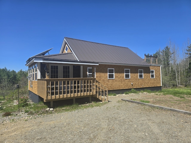 241 Baker Brook Rd, Bradley, ME 04411 - rear view of house featuring a wooden deck and metal roof