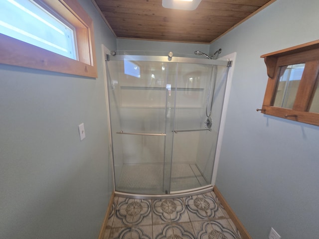 241 Baker Brook Rd, Bradley, ME 04411 - bathroom with a shower stall, baseboards, and wood ceiling