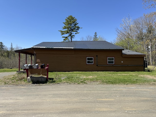 7 Thomas Rd, Sangerville, ME 04479 - view of side of home featuring metal roof