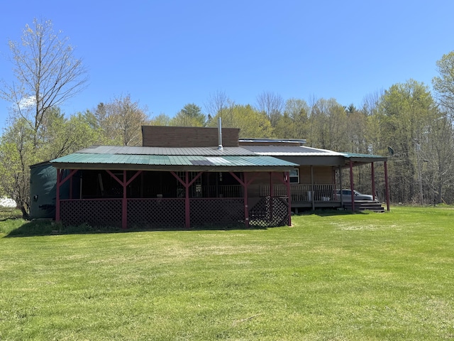 7 Thomas Rd, Sangerville, ME 04479 - back of house featuring a yard and a forest view