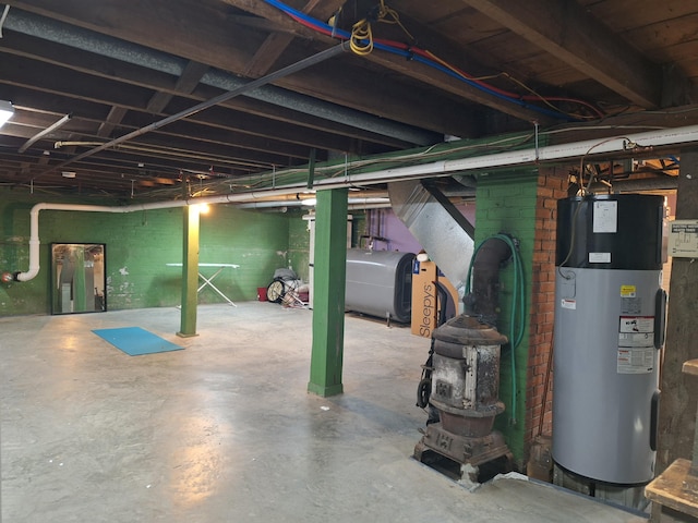 unfinished below grade area with hybrid water heater and heating fuel