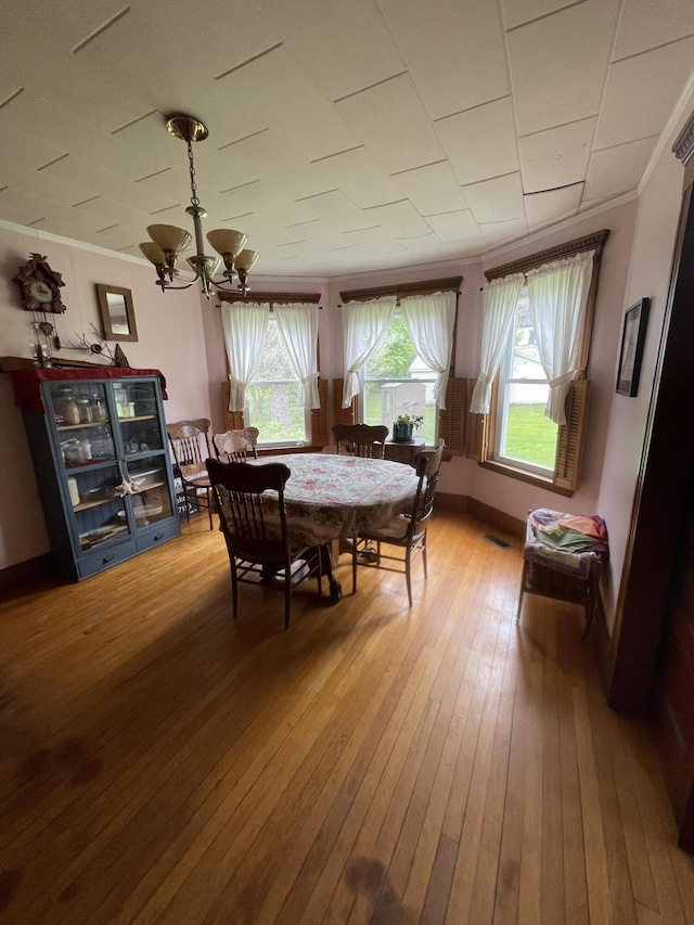 27 Murray St, Bingham, ME 04920 - dining area with a chandelier, hardwood / wood-style flooring, and ornamental molding