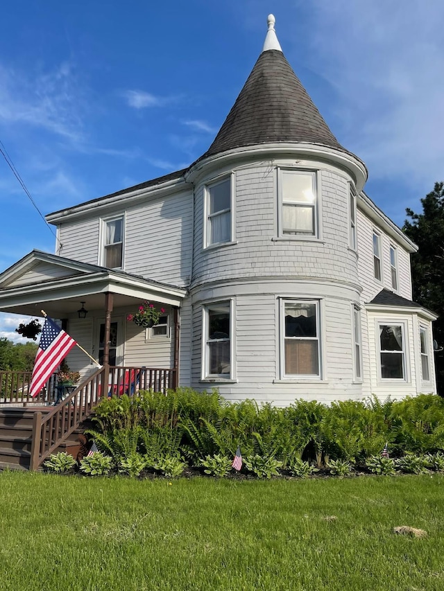 27 Murray St, Bingham, ME 04920 - view of front of house featuring a porch, a front yard, and roof with shingles