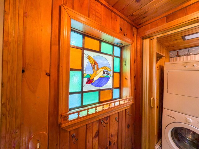 19 Pulpit Rock Rd, Raymond, ME 04071 - laundry area featuring estacked washer and dryer, wood walls, and wood ceiling