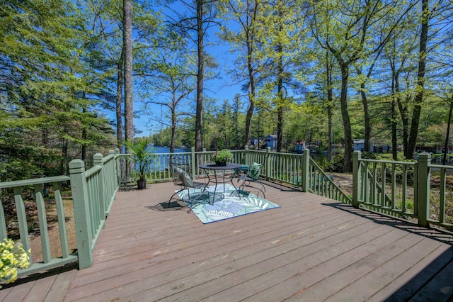 19 Pulpit Rock Rd, Raymond, ME 04071 - wooden terrace featuring outdoor dining space