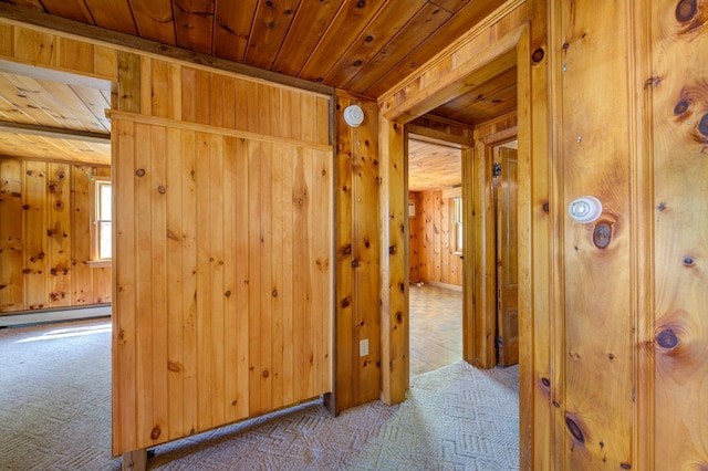 19 Pulpit Rock Rd, Raymond, ME 04071 - corridor with wood ceiling, carpet, wooden walls, and a baseboard heating unit