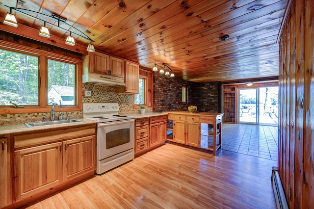 19 Pulpit Rock Rd, Raymond, ME 04071 - kitchen with electric range, a sink, under cabinet range hood, wood ceiling, and light countertops