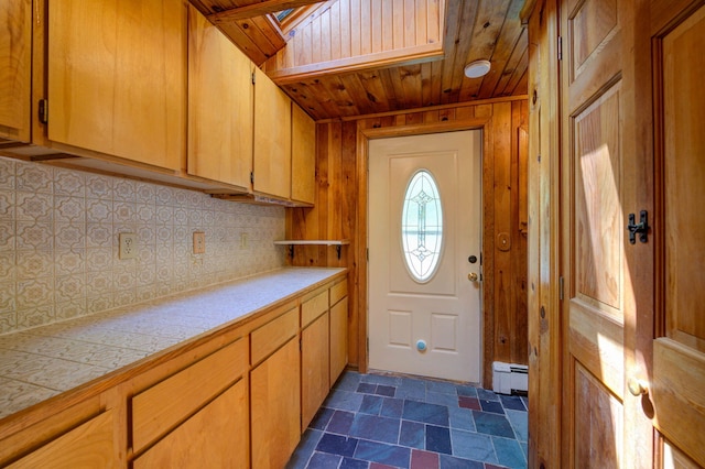19 Pulpit Rock Rd, Raymond, ME 04071 - entryway with baseboard heating, a skylight, wooden ceiling, wooden walls, and dark stone finish flooring