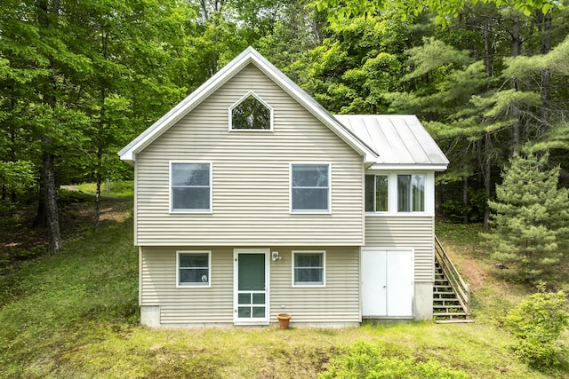 67 Day Mountain Rd, Temple, ME 04984 - rear view of house with stairway, a standing seam roof, and a metal roof
