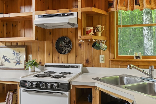 67 Day Mountain Rd, Temple, ME 04984 - kitchen with white electric stove, under cabinet range hood, light countertops, wooden walls, and open shelves