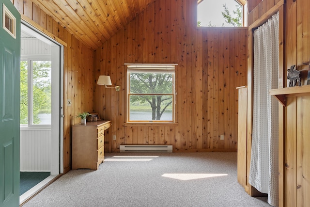 67 Day Mountain Rd, Temple, ME 04984 - interior space featuring baseboard heating, vaulted ceiling, carpet floors, and wooden walls