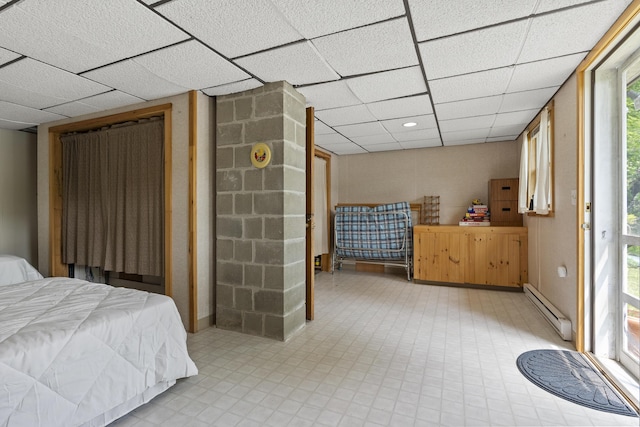 67 Day Mountain Rd, Temple, ME 04984 - bedroom featuring a baseboard heating unit and a paneled ceiling