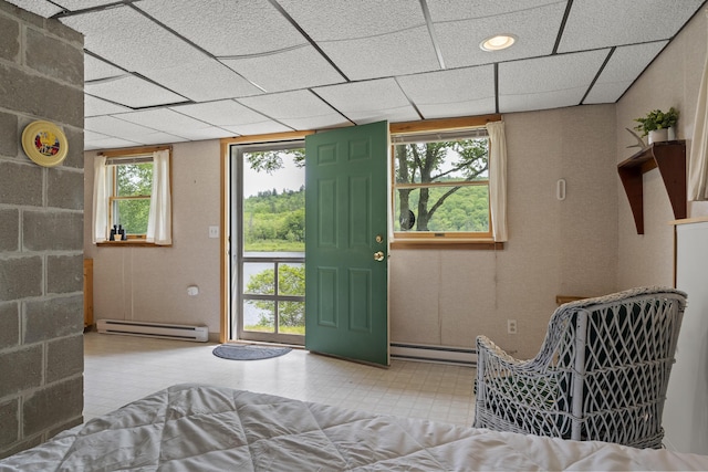 67 Day Mountain Rd, Temple, ME 04984 - foyer featuring baseboard heating, a paneled ceiling, and tile patterned floors