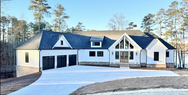 80 Indian Rivers Dr, Eliot, ME 03903 - modern inspired farmhouse featuring driveway, board and batten siding, a chimney, an attached garage, and roof with shingles