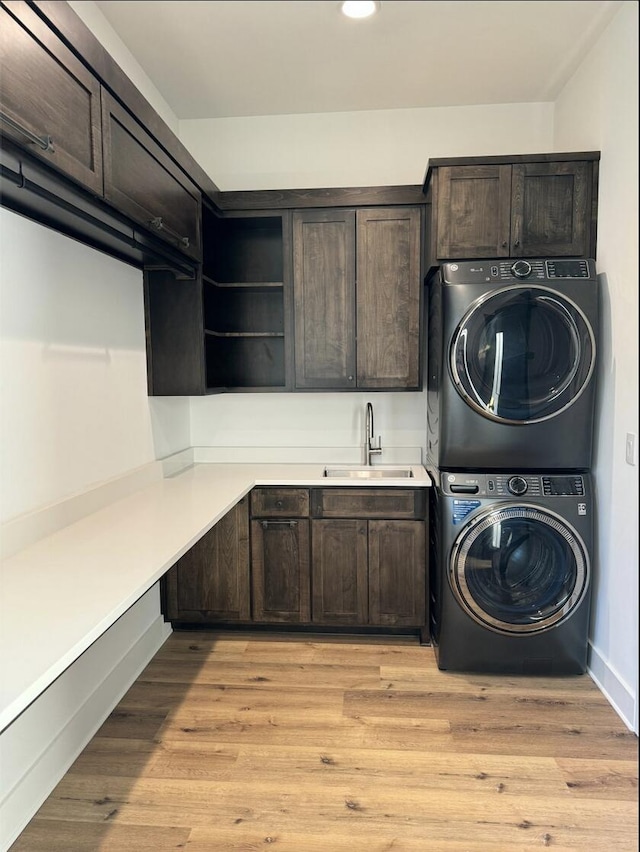 80 Indian Rivers Dr, Eliot, ME 03903 - laundry room featuring stacked washing machine and dryer, cabinet space, recessed lighting, and light wood finished floors