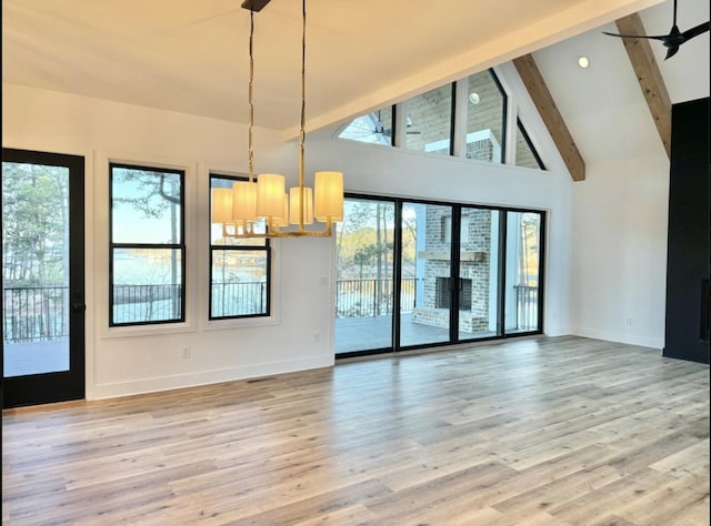 80 Indian Rivers Dr, Eliot, ME 03903 - spare room featuring healthy amount of natural light, beam ceiling, ceiling fan, light wood finished floors, and high vaulted ceiling