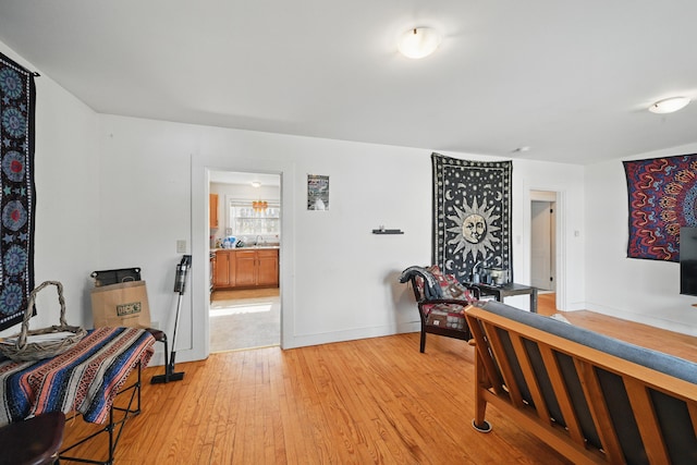 19 Brann Ave, Augusta, ME 04330 - bedroom with light wood-type flooring, baseboards, and ensuite bathroom