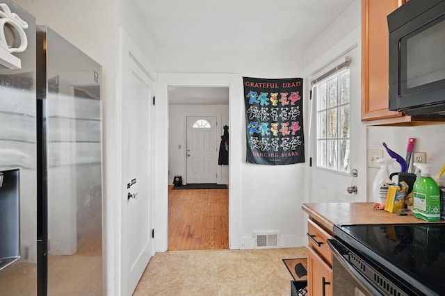 19 Brann Ave, Augusta, ME 04330 - kitchen with black microwave and range with electric cooktop