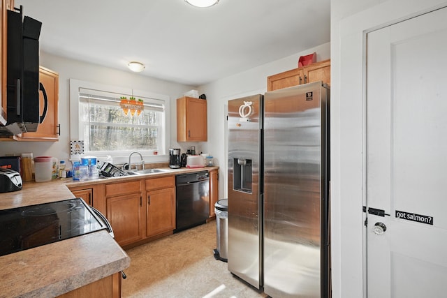 19 Brann Ave, Augusta, ME 04330 - kitchen featuring black dishwasher, stainless steel fridge, and light countertops