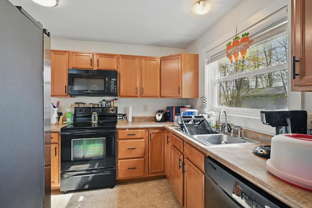 19 Brann Ave, Augusta, ME 04330 - kitchen featuring black appliances, a sink, and light countertops