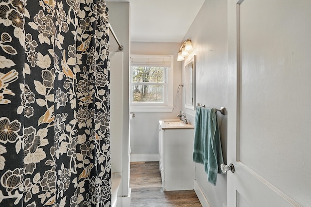 19 Brann Ave, Augusta, ME 04330 - full bath with a shower, wood finished floors, vanity, and baseboards