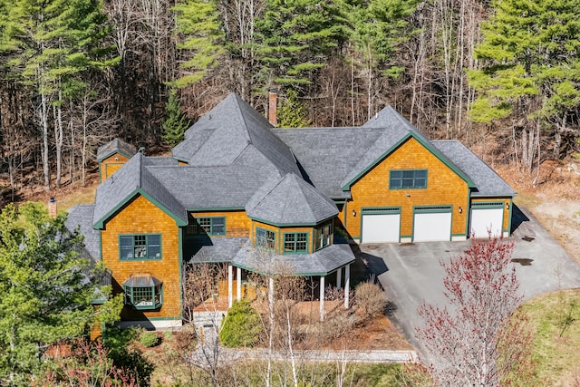 1026 Essex St, Bangor, ME 04401 - view of front of property with asphalt driveway, a shingled roof, and a garage
