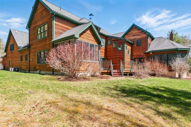 1026 Essex St, Bangor, ME 04401 - rear view of house with a yard, a deck, central AC unit, and roof with shingles
