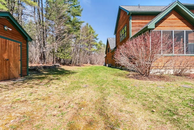 1026 Essex St, Bangor, ME 04401 - view of grassy yard with a sunroom