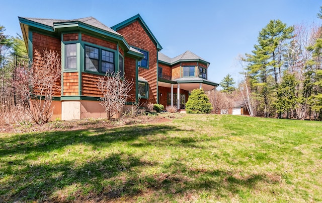 1026 Essex St, Bangor, ME 04401 - view of front facade featuring a front yard