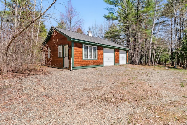 1026 Essex St, Bangor, ME 04401 - garage featuring dirt driveway