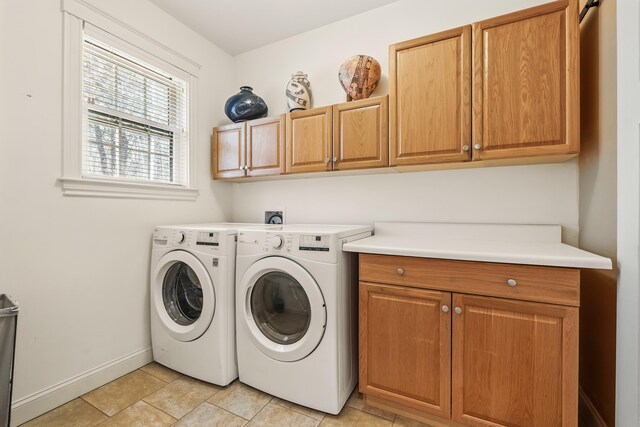 1026 Essex St, Bangor, ME 04401 - laundry room with cabinet space, washing machine and dryer, baseboards, and light tile patterned floors