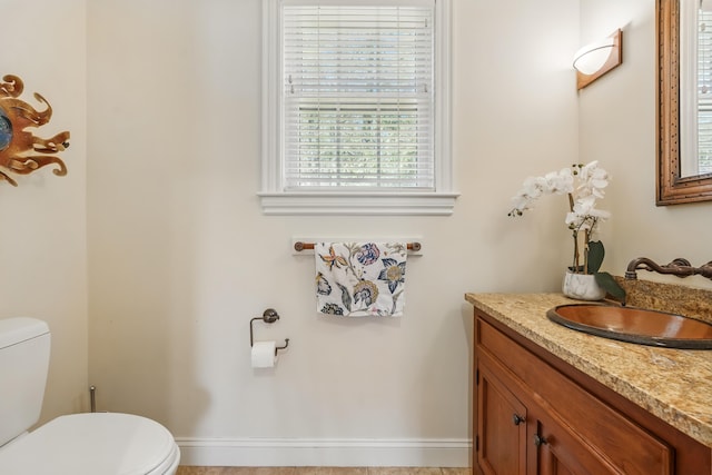 1026 Essex St, Bangor, ME 04401 - bathroom featuring toilet, healthy amount of natural light, and vanity