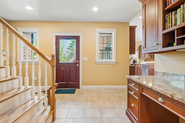 1026 Essex St, Bangor, ME 04401 - entrance foyer with stairway, baseboards, recessed lighting, and light tile patterned flooring