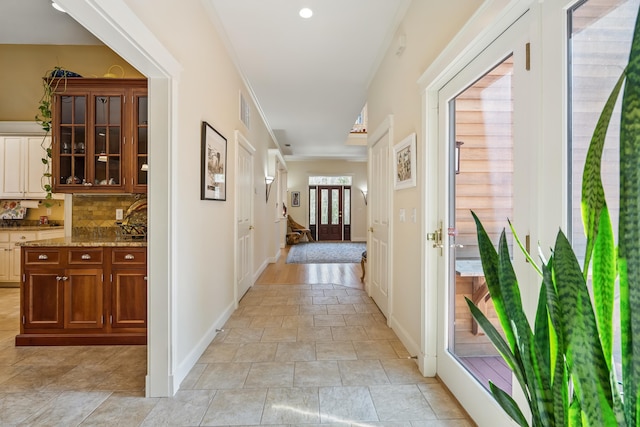 1026 Essex St, Bangor, ME 04401 - hall featuring stone finish floors, baseboards, and ornamental molding
