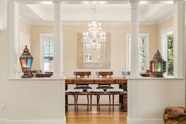 1026 Essex St, Bangor, ME 04401 - bar area with wood finished floors, crown molding, ornate columns, a raised ceiling, and a chandelier