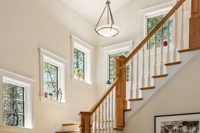 1026 Essex St, Bangor, ME 04401 - stairs featuring healthy amount of natural light and high vaulted ceiling