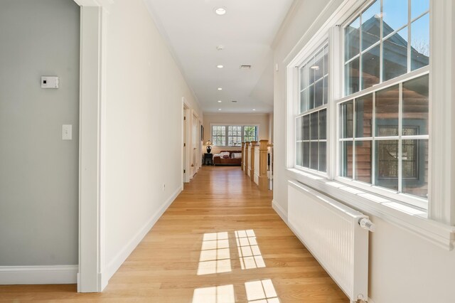 1026 Essex St, Bangor, ME 04401 - hall featuring radiator heating unit, light wood-style flooring, recessed lighting, and baseboards