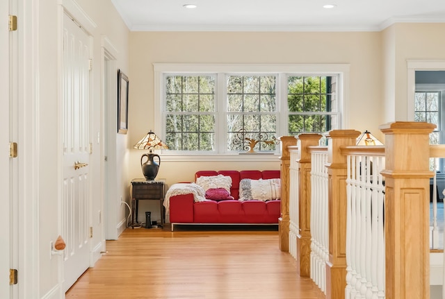 1026 Essex St, Bangor, ME 04401 - sitting room featuring light wood-style floors, crown molding, an upstairs landing, recessed lighting, and baseboards