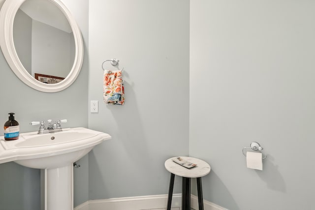 1026 Essex St, Bangor, ME 04401 - bathroom featuring baseboards and a sink