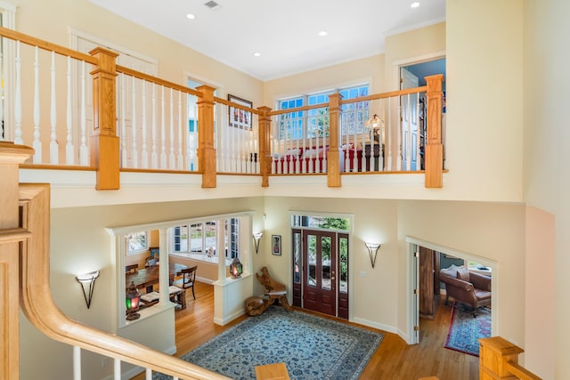 1026 Essex St, Bangor, ME 04401 - entrance foyer with wood finished floors, a high ceiling, baseboards, ornamental molding, and recessed lighting