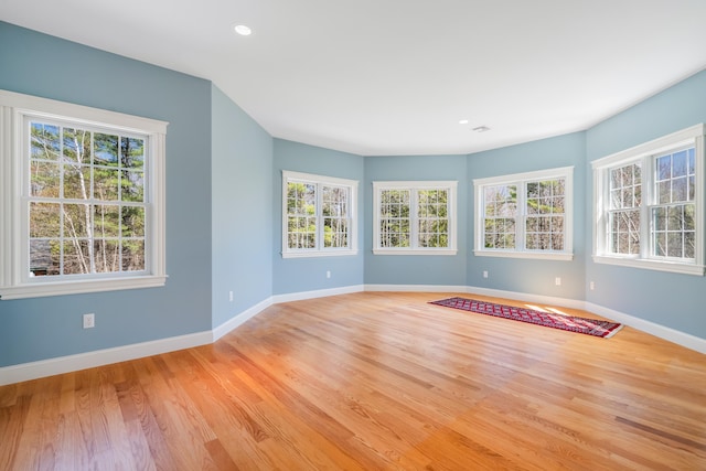 1026 Essex St, Bangor, ME 04401 - unfurnished room featuring healthy amount of natural light, baseboards, light wood-style floors, and recessed lighting
