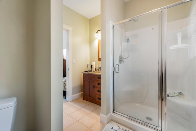 1026 Essex St, Bangor, ME 04401 - bathroom with a shower stall, tile patterned flooring, vanity, toilet, and baseboards