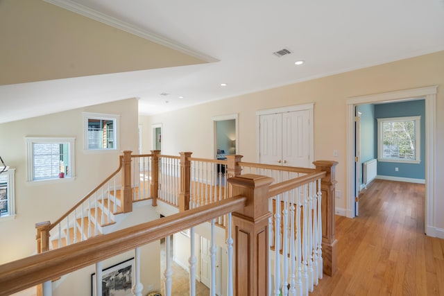 1026 Essex St, Bangor, ME 04401 - hallway with an upstairs landing, crown molding, light wood finished floors, baseboards, and recessed lighting