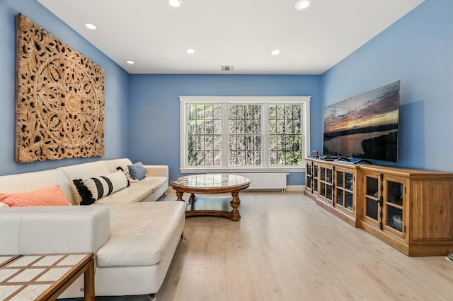 1026 Essex St, Bangor, ME 04401 - living area with wood finished floors, recessed lighting, and baseboards